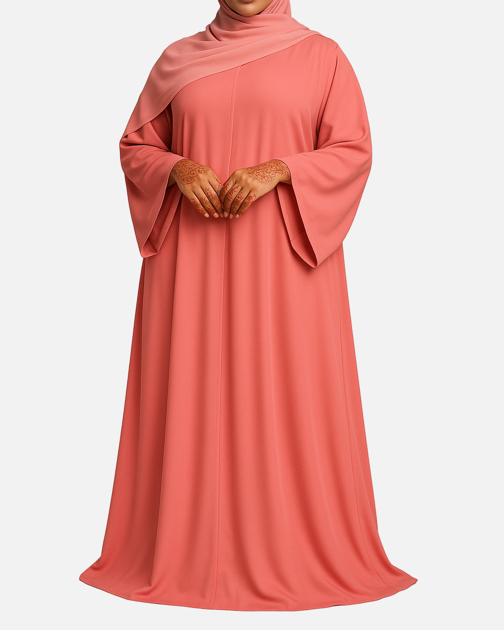 Woman wearing a coral abaya with a matching hijab on a plain background