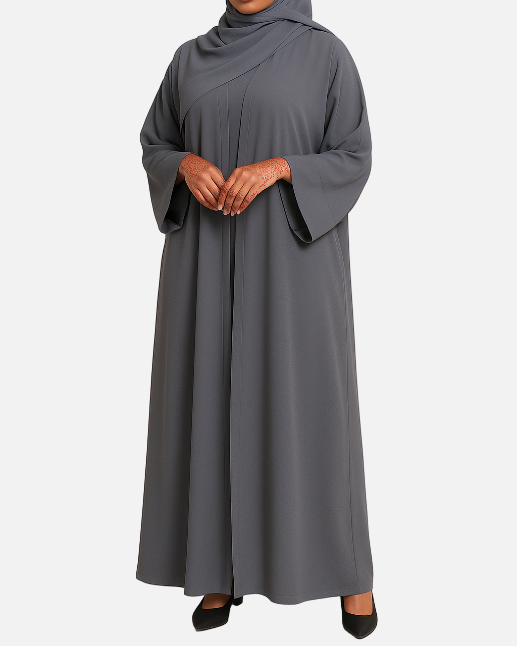 Woman wearing a gray abaya and hijab on a beige background